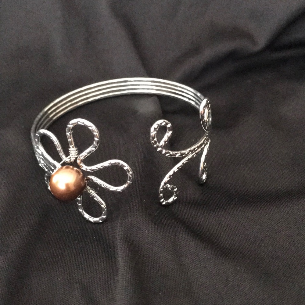 Silver plumeria flower bracelet with brown bead